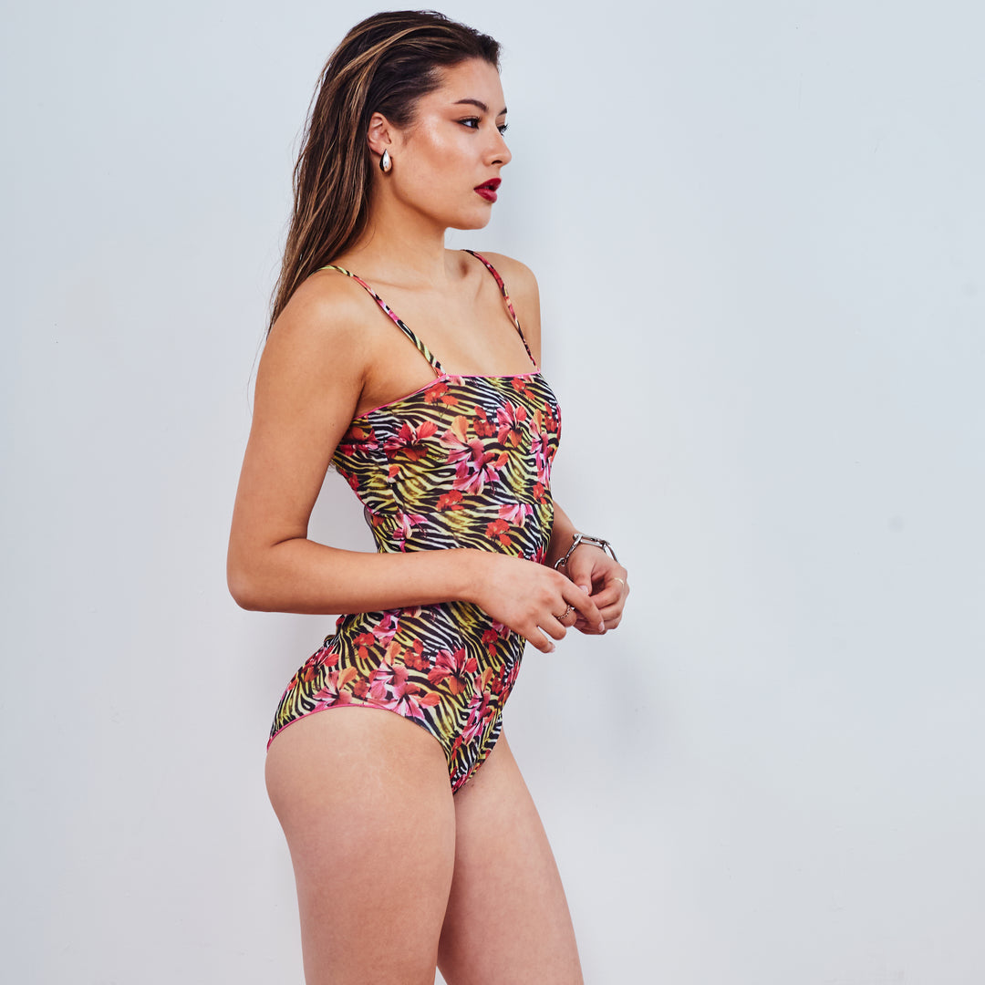 Girl looking sideways in bandeau swimsuit