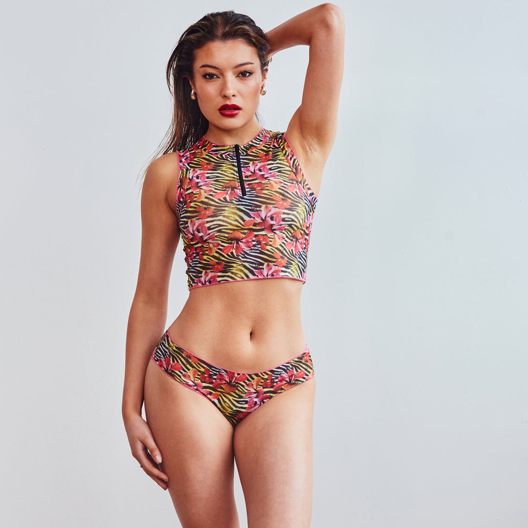 Girl in racer top bikini holding hair