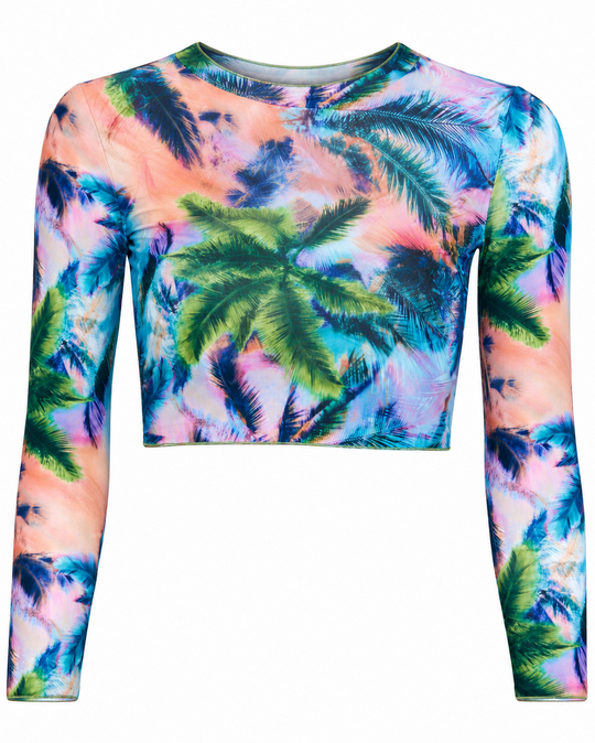 A long-sleeve crop top featuring a vibrant tropical palm tree print in shades of blue, pink, green, and purple, displayed against a solid white background.