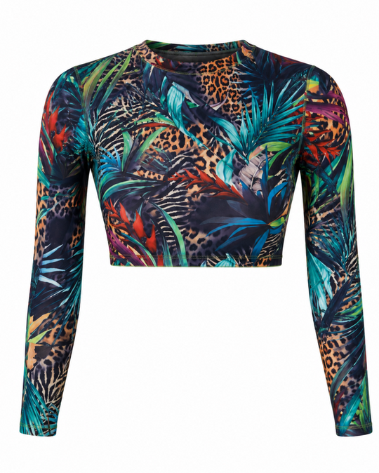 A long-sleeve crop top featuring a vibrant, dense tropical print with palm leaves, leopard spots, and colorful floral elements on a solid white background.