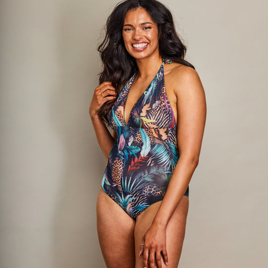 Girl in dark print halterneck swimsuit